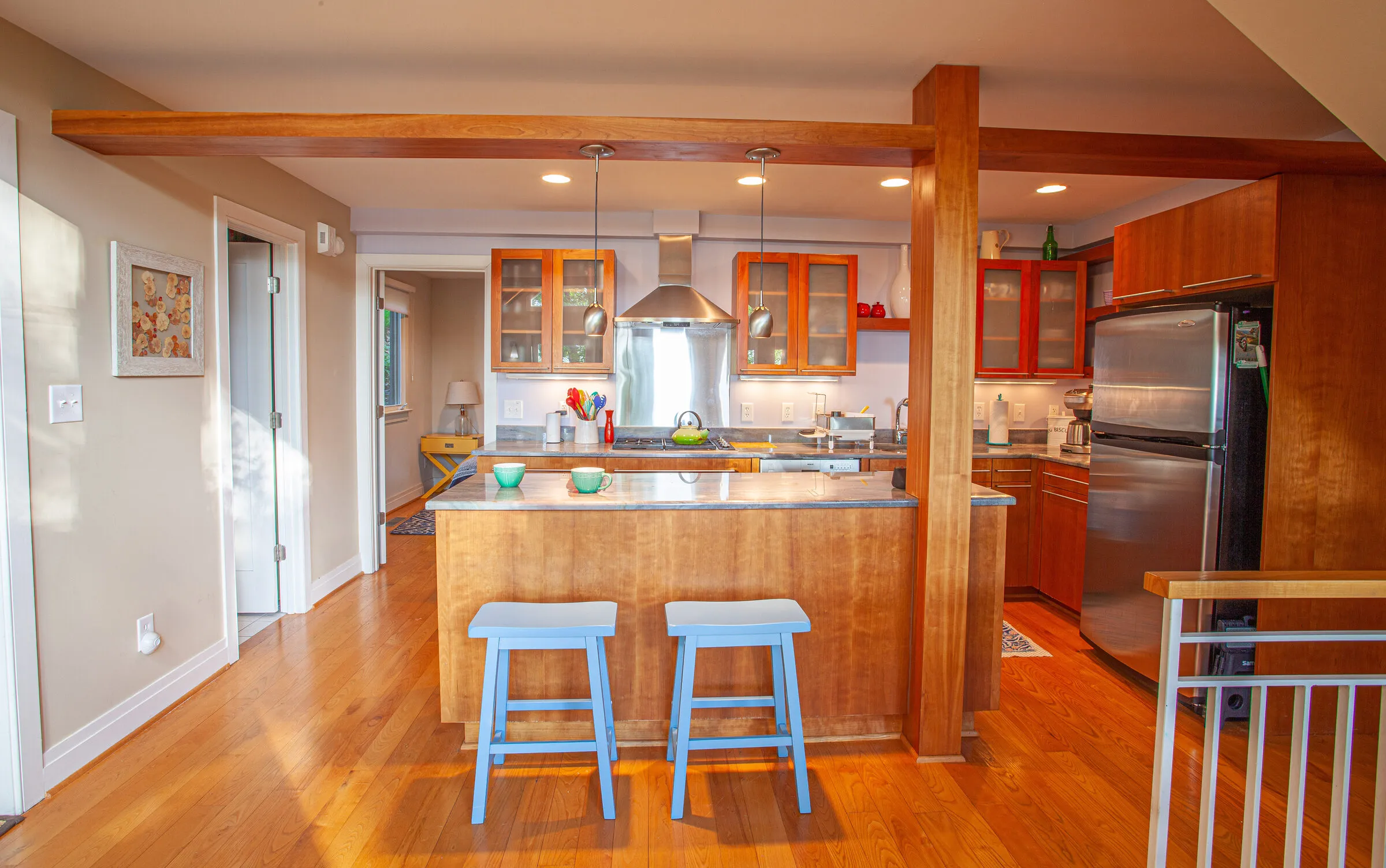 Kitchen with granite island and bar stools
